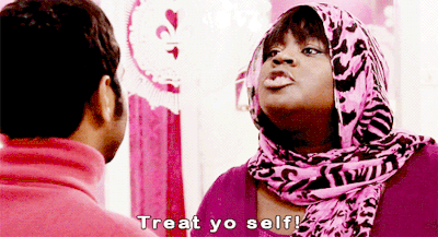 Gif of Donna from Parks and Rec telling Tom to "treat yo self!"