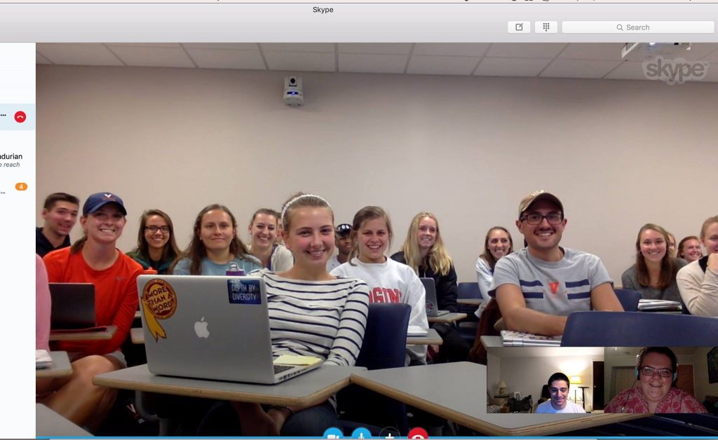 Emily and Kyle in a Skype window talking to a classroom full of young adults about disability.