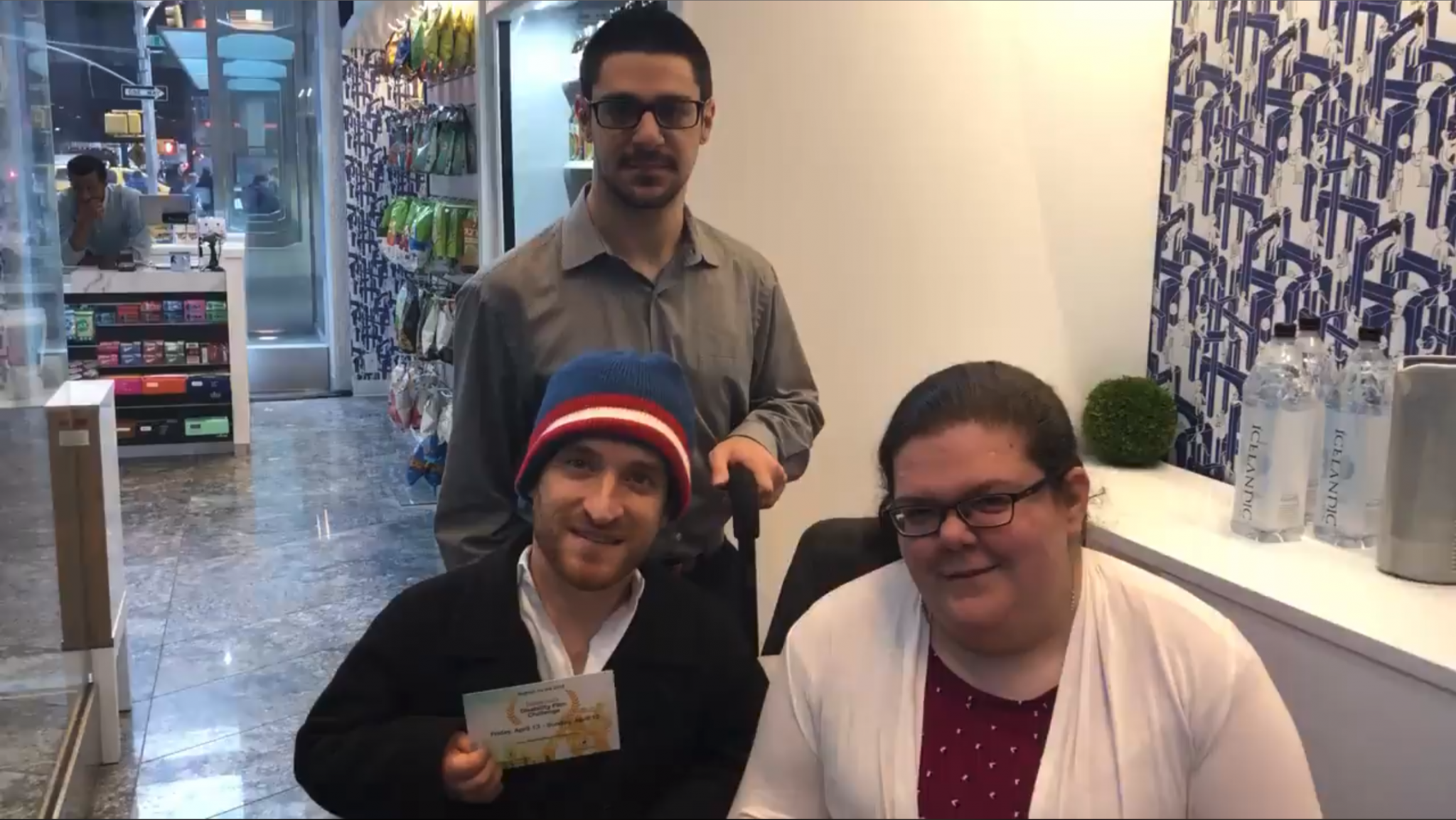 Emily and Kyle pose with Nic Novicki at a cafe in Midtown.